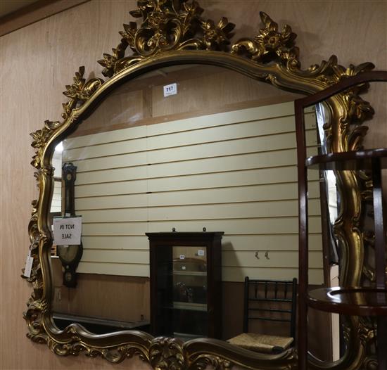 A rococo gilt wall mirror W.120cm